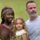 Michonne (Danai Gurira), Judith (Chloe Garcia), and Rick (Andrew Lincoln) get a family portrait made at Sears